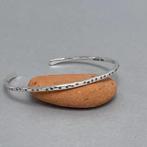 Open silver bangle - oval dots